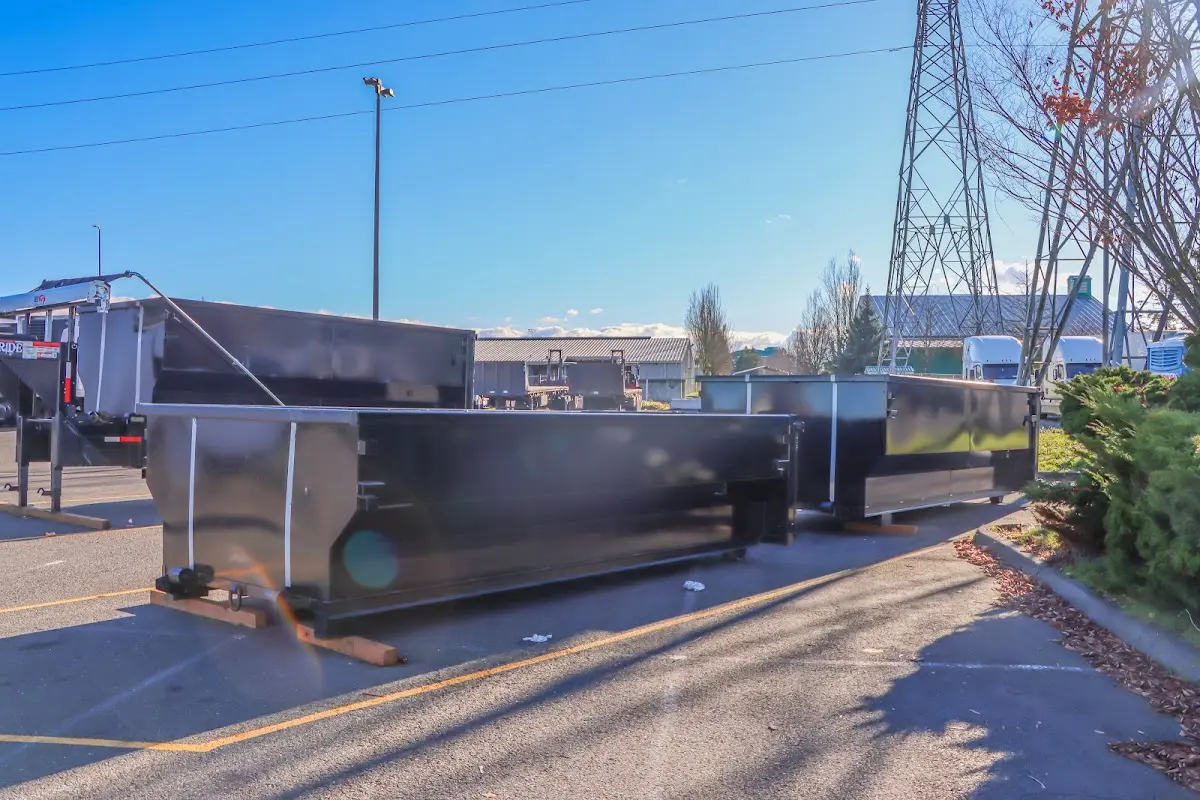 Roll-off dumpster ready for waste disposal at job site for 2 Yard Dumpster Rental in Byron